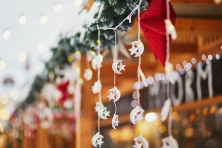 Colorful Christmas decorations and glass lanterns on a Christmas market