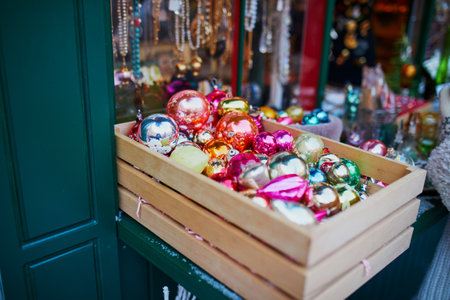 Many Christmas balls in wooden crate on a Christmas marketの写真素材