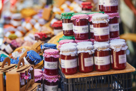 CUCURON, FRANCE - JULY 21, 2022: Various types of jams and honeys on Mediterranean farmer market in...