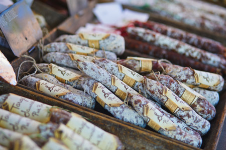 CUCURON, FRANCE - JULY 21, 2022: Various types of sausages on Mediterranean farmer market in Provence, Franceのeditorial素材
