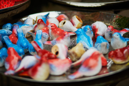 Beautiful colorful ceramic birds on a dutch market in the Netherlandsの写真素材
