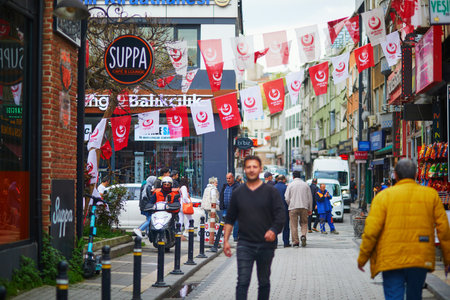ISTANBUL, TURKEY - APRIL 26, 2023: People walking by a street in Uskudar district in Istanbul, Turkeyのeditorial素材