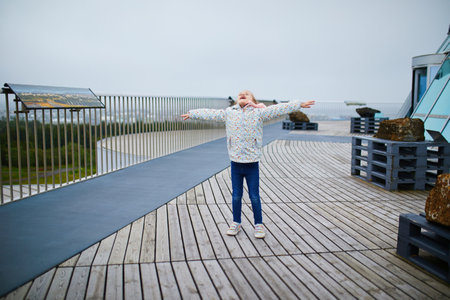 Happy adorable preschooler girl having fun in Reykjavik, Iceland