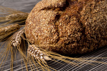 Rye bread lying on wooden table withの写真素材