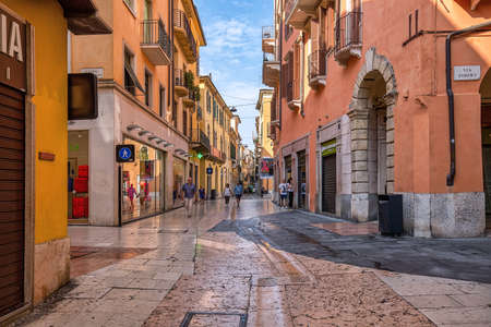 VERONA, ITALY - July 19th, 2019: Pedestrian streets in historic center of the city, typical architecture and atmosphereのeditorial素材