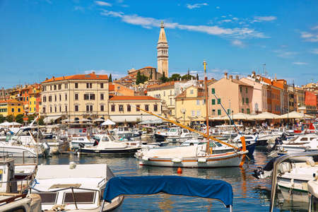 ROVINJ, CROATIA - July 29th, 2019: Boats in the harbour with the view to old townのeditorial素材