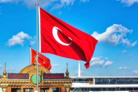 ISTANBUL, TURKEY - October 10th, 2019: Turkish flag in Eminonu pier