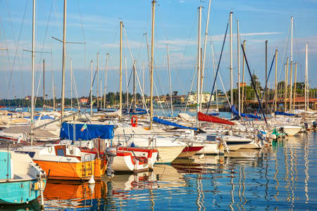 DESENZANO, ITALY - July 16th, 2019: Sailboats in the harbour on Lake Gardaのeditorial素材