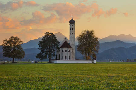 St. Coloman church in Bavaria, beautiful sunset outdoor backgroundの写真素材