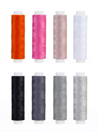 Set of sewing thread coils, miscellaneous colours, isolated on whiteの写真素材