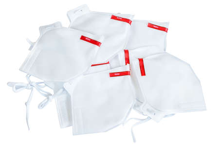 Heap of  medical masks isolated on whiteの写真素材