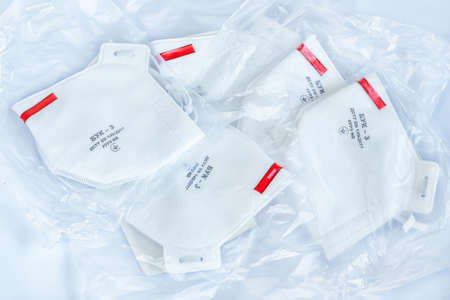 KHARKIV, UKRAINE - March 29th, 2020: Heap of FFP3 medical masks in transparent packageのeditorial素材