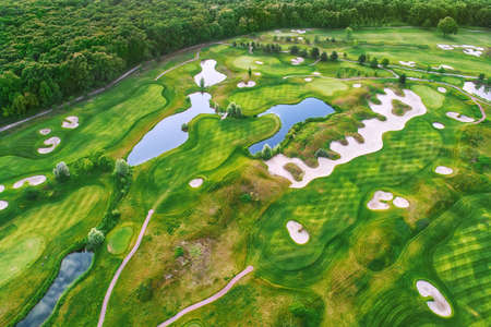 Aerial view to golf course, sport and recreation backgroundの写真素材