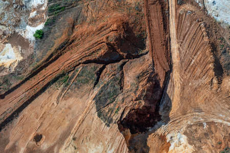 Aerial view to sand quarry, abstract earth patterns