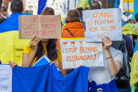 BRUSSELS, BELGIUM - March, 24th, 2022. War in Ukraine: hundreds of supporters of Ukraine gathered in Brussels during NATO summit to urge European leaders to provide weapon to Ukraine and refuse from russian gas.のeditorial素材