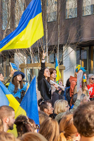 BRUSSELS, BELGIUM - March, 24th, 2022. War in Ukraine: hundreds of supporters of Ukraine gathered in Brussels during NATO summit to urge European leaders to provide weapon to Ukraine and refuse from russian gas.のeditorial素材