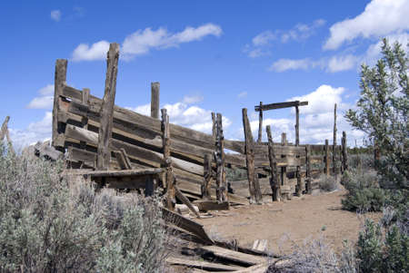 Old dilapitated cattle loading chute amongs the sage and rabbit brush in the Central Oregon desert.の写真素材