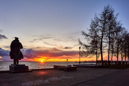 sunset on the background of the monument and the riverの写真素材