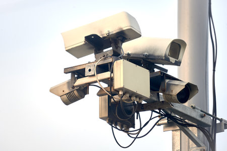 a video recording camera of violations is hanging on a poleの写真素材