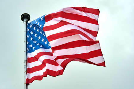 The USA flag is hanging on the flagpoleの写真素材