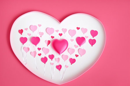 Valentine's day background. Heart shaped candies on pink backgroundの素材