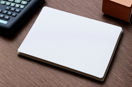 Blank business cards on wooden table with calculator and copy space.の素材
