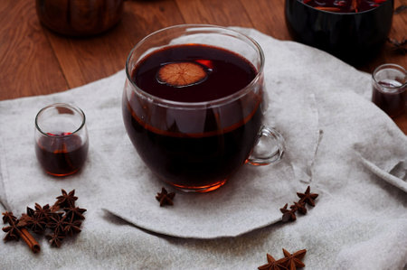 Mulled wine with chocolate chips and spices on a black backgroundの素材