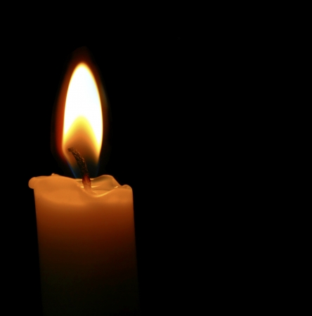 Candle Isolated on black, melted waxの写真素材