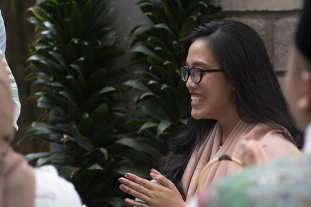 asian muslim hand shaking during ramadan celebration