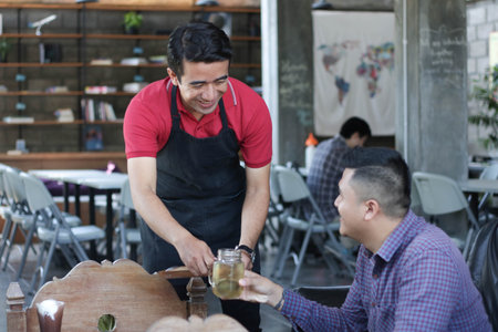 costumers receives food and drink from waiters and server at cafe and restaurant. female waiters...