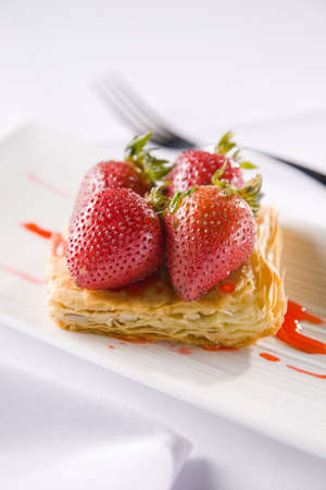 strawberries with crunchy pastry and red sauceの写真素材