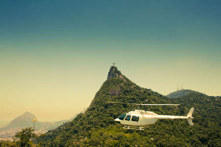 sightseeing helicopter in front of Corcovado and the statue of Christの写真素材