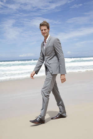 Business man on the beachの写真素材