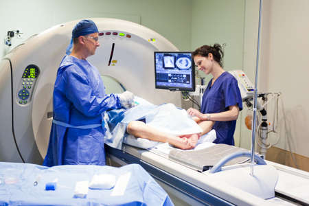 MRI machine with doctor, nurse and patient