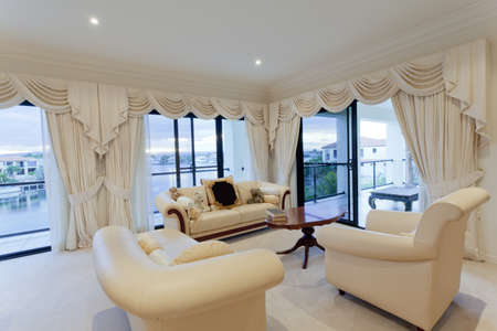 Stylish living room with view of waterfront houses