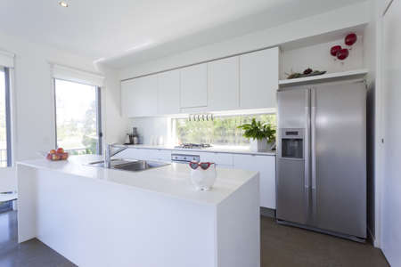 Modern kitchen with stainless steel appliances in Australian mansion Modern kitchen with stainless steel appliances in Australian mansion