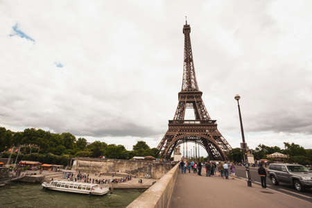 Street view of the Eiffel Tower in Paris on a Cloudy afternoonのeditorial素材