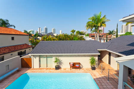 balcony view from modern australian home looking at pool area and skyline