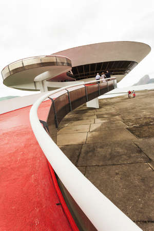 Exterior and entrance of Niteroi art museum with people walking through up the pathのeditorial素材