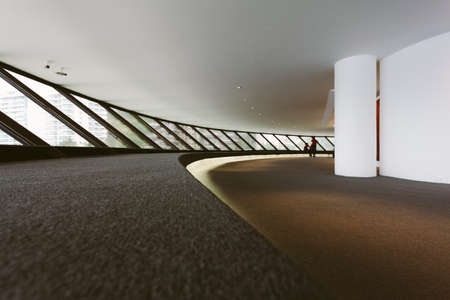 Interior of Niteroi art museum with people observing the artのeditorial素材