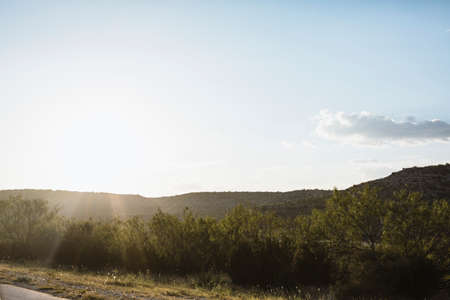 lush countryside landscape in Texas with the sun settingの写真素材