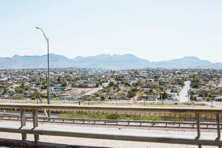 Cityscape of El Paso from the highway, withountains in the background