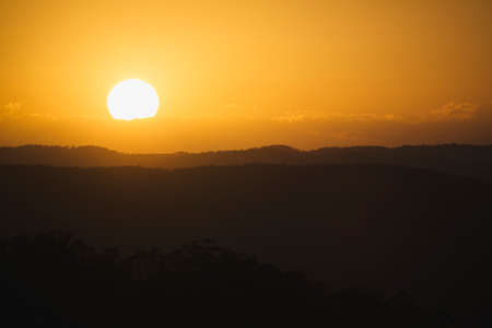 A beautiful sunset over the Sunshine Coast hinterland.  Located at Mapleton Falls, QLD, Australia.の写真素材