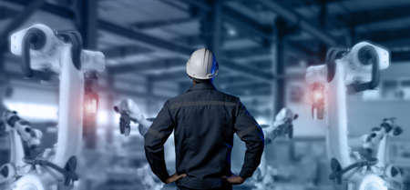 futuristic industry 4.0 technology concept, engineer stand in front of robot in manufacturing and...