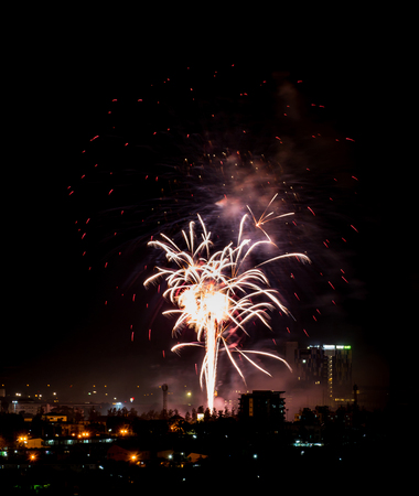 Brightly colorful fireworks and salute of various colors in the night skyの写真素材