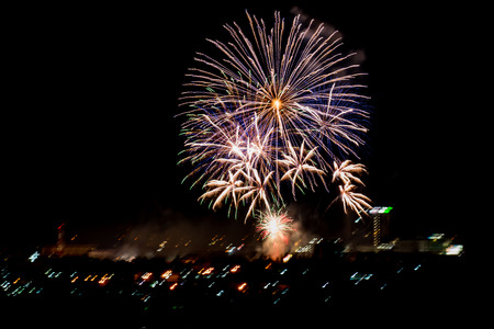 Brightly colorful fireworks and salute of various colors in the night skyの写真素材
