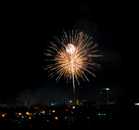 Brightly colorful fireworks and salute of various colors in the night skyの写真素材