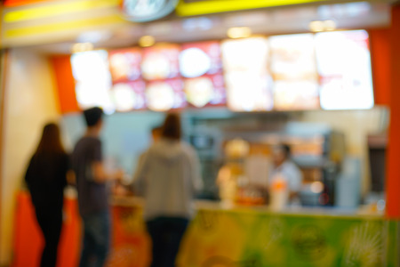 Blurred people order fast food for backgroundの写真素材