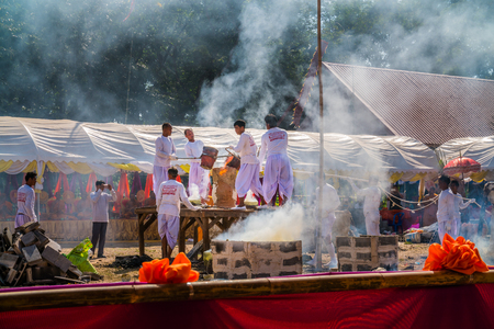 BURIRAM THAILAND - JAN 2 : Buddhist metal cast ceremony for buddha statue , Pouring molten metal in mold . Jan 2,2017 in Lok Molee Temple, Buriram, Thailand.のeditorial素材