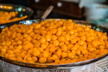 Candy golden ball on hand, Thai dessert.の写真素材